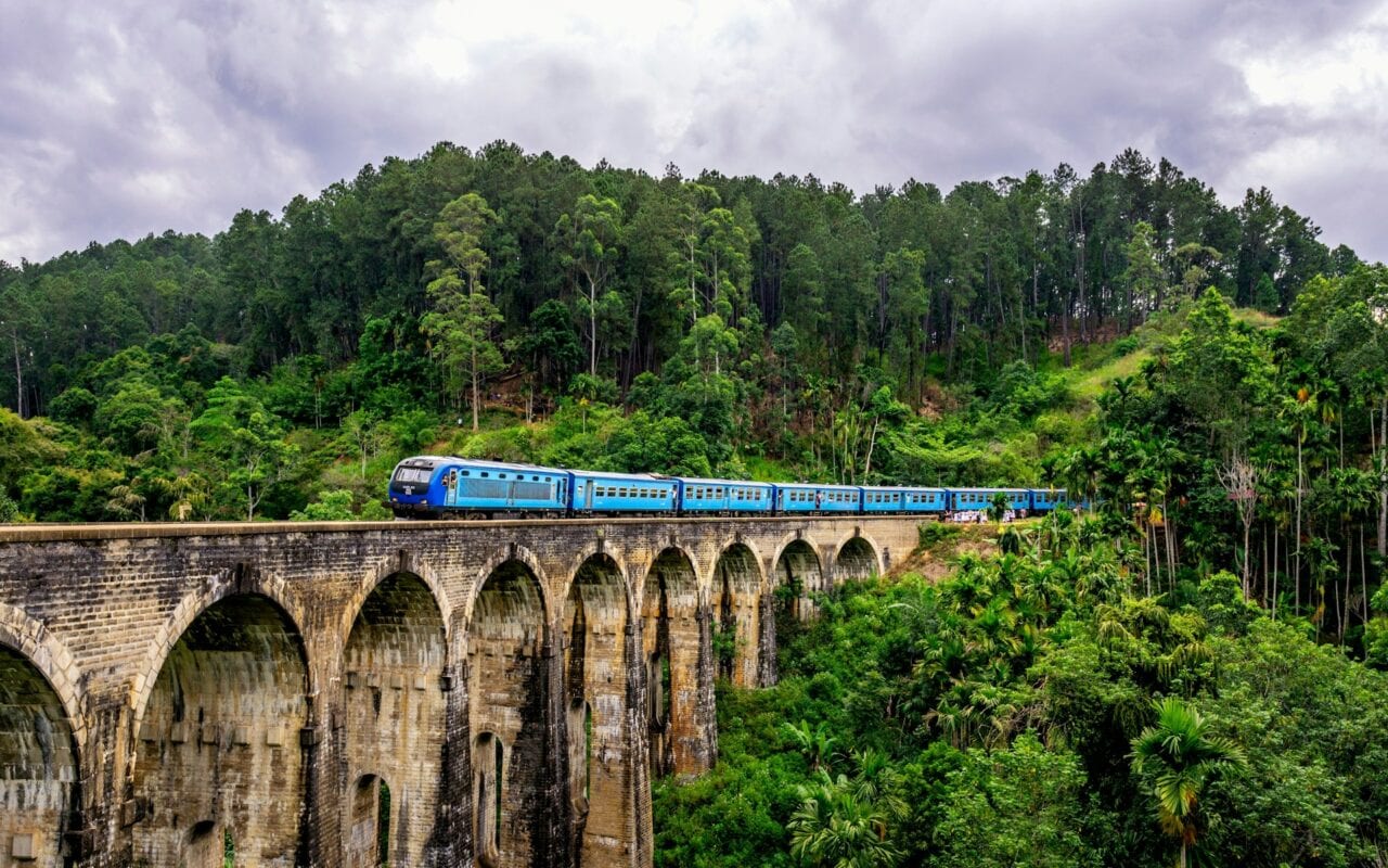Tea-covered hills and a train viaduct in Sri Lanka's central highlands near Ella